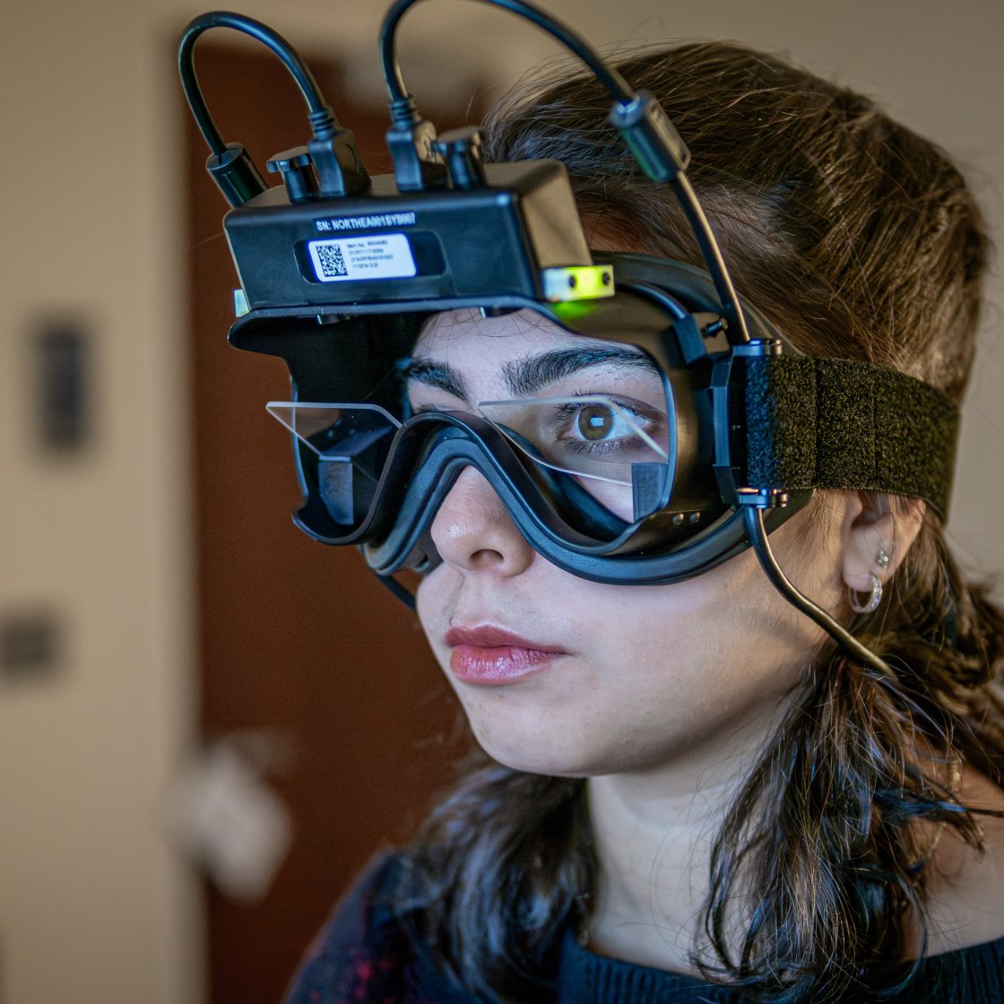 A student wears virtual reality goggles.