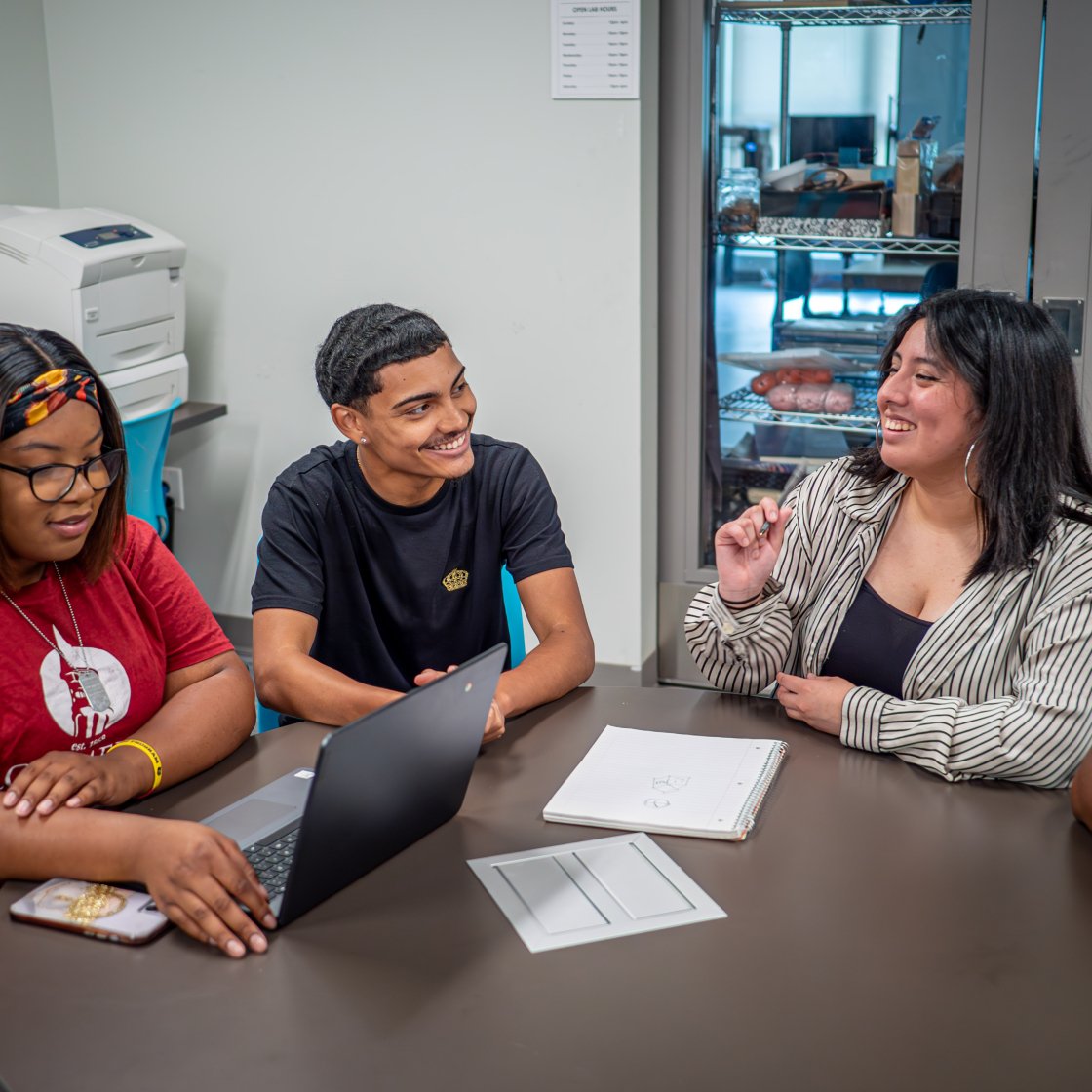 Four students sitting at a table