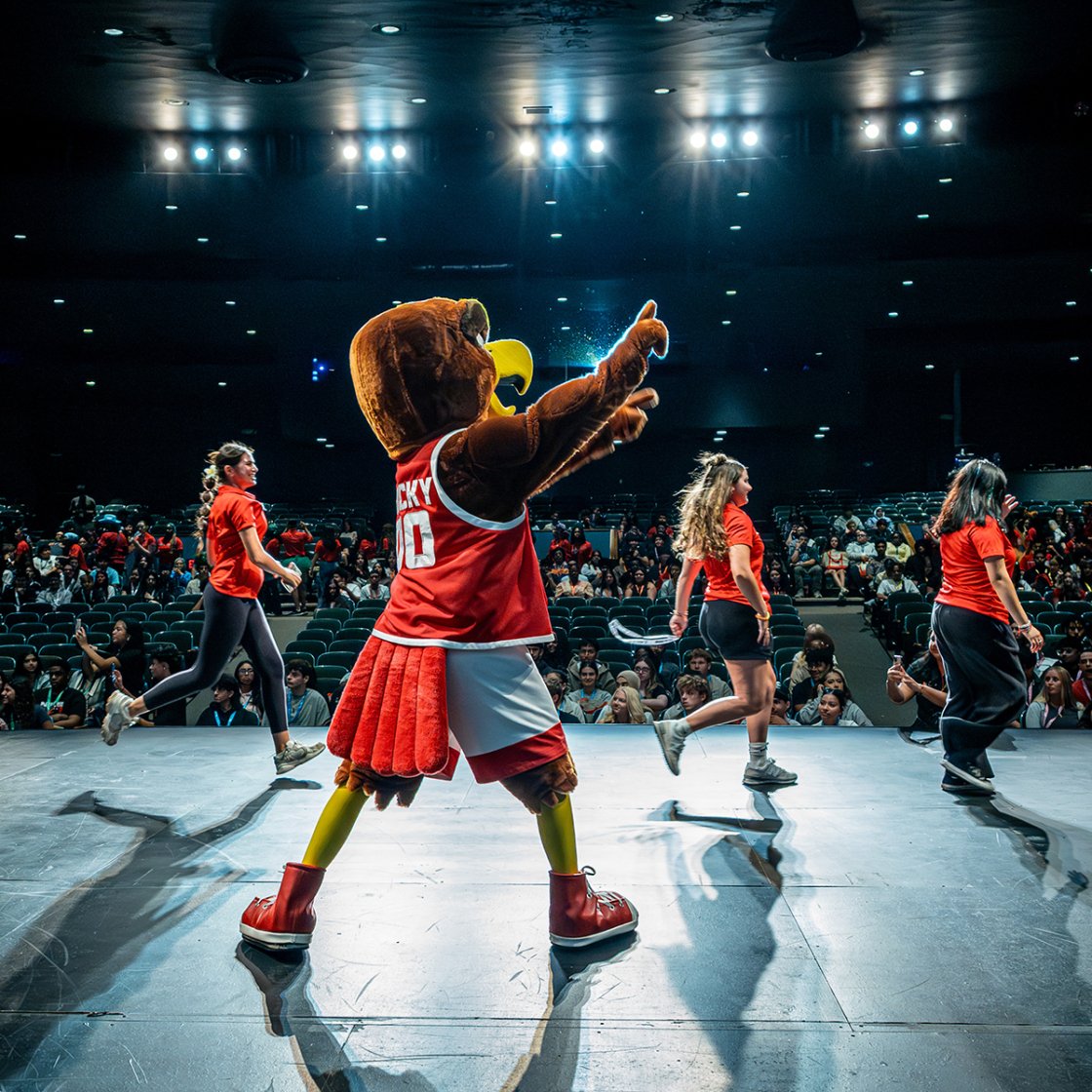 Rocky and Orientation Leaders on stage