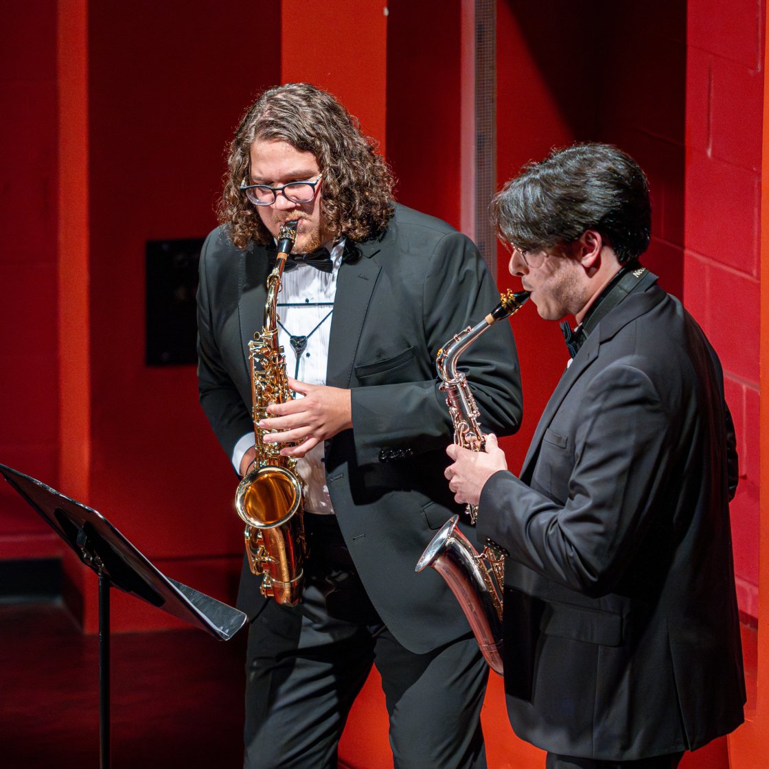 Two saxophone student performers on stage in Kasser Theater