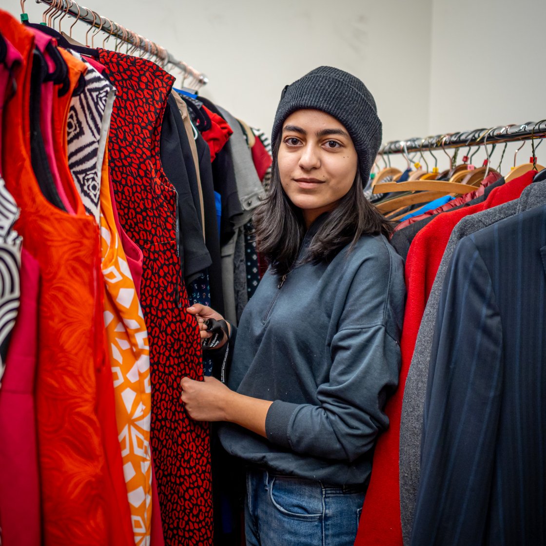 Student browsing through dresses at Rocky's Closet