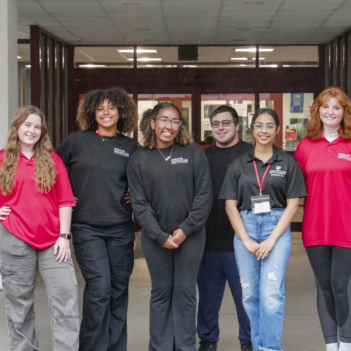 group of residence life student staff standing outside