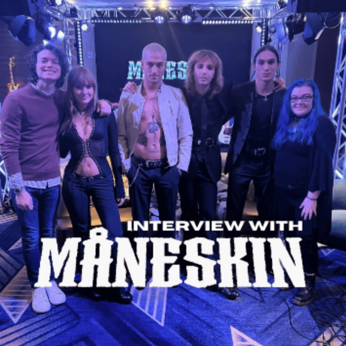Students pose with famous rock band, Maneskin.