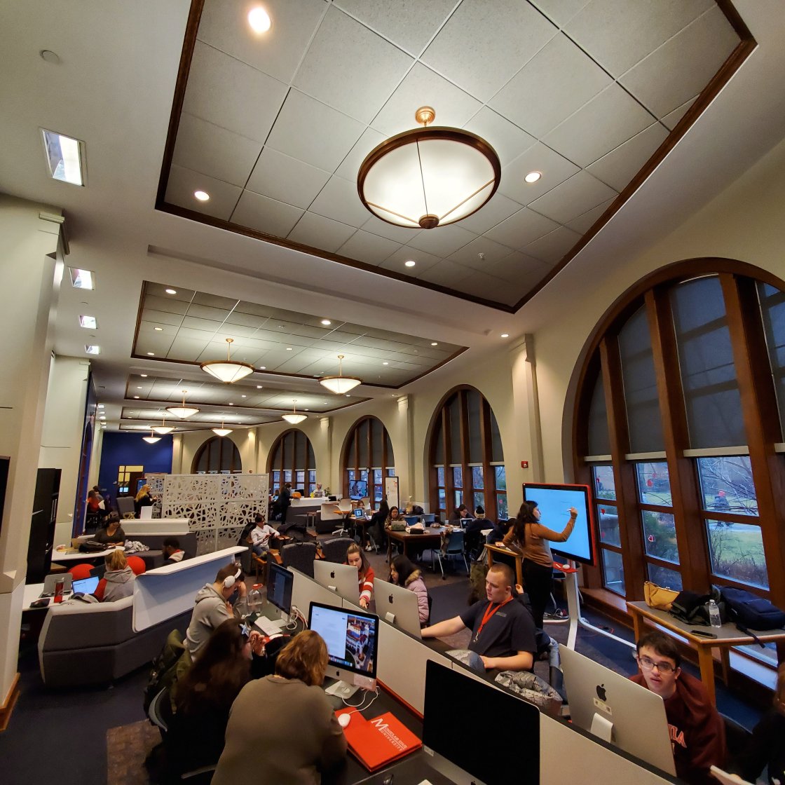 Students working on computers in common area