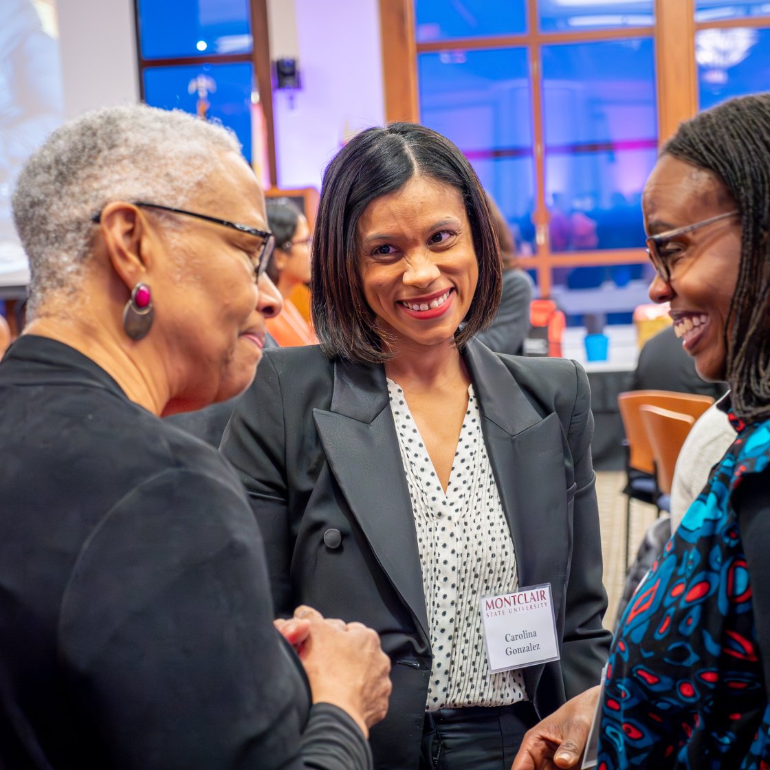three women chat at the Evening of Gratitude
