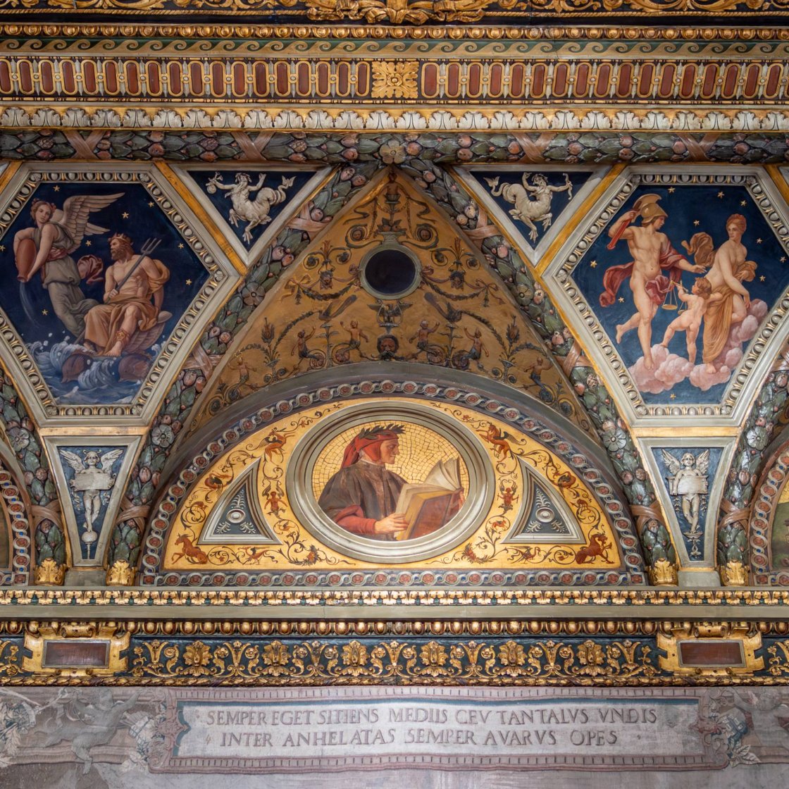 Bright restored Romanesque-style fresco on a ceiling cornice in a museum gallery, with gold colors and ornate details.