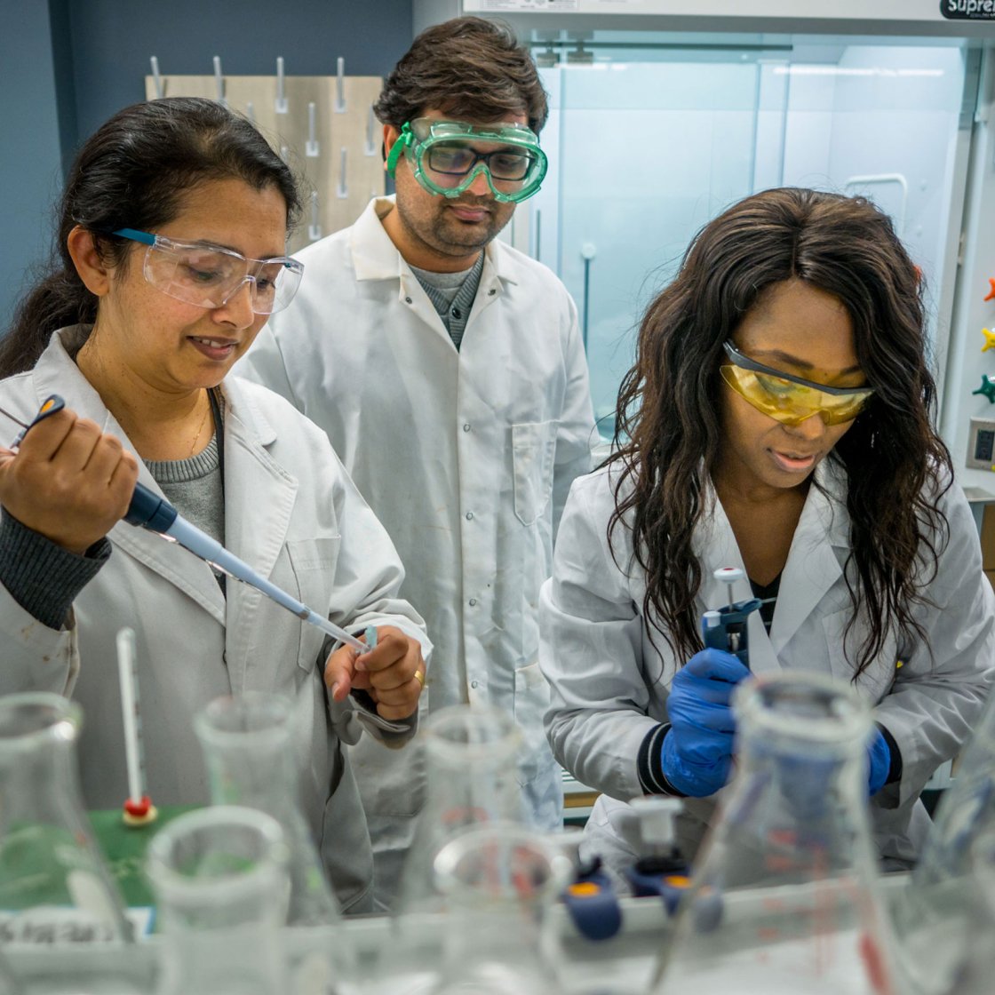 students conducting research in a chemistry lab