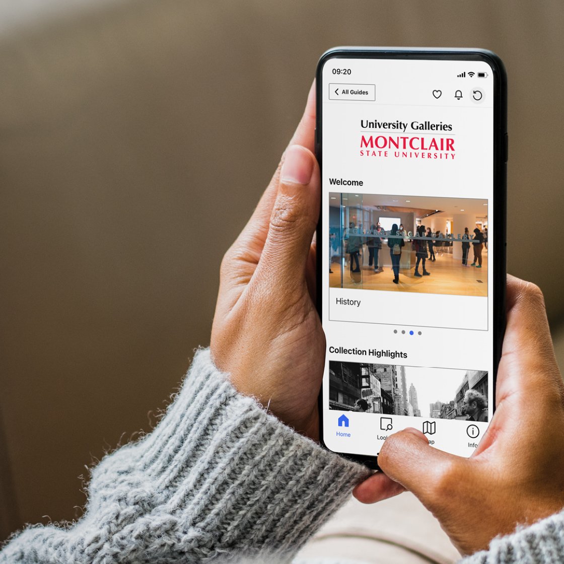 Person looking at their phone with Bloomsberg Connects on the screen