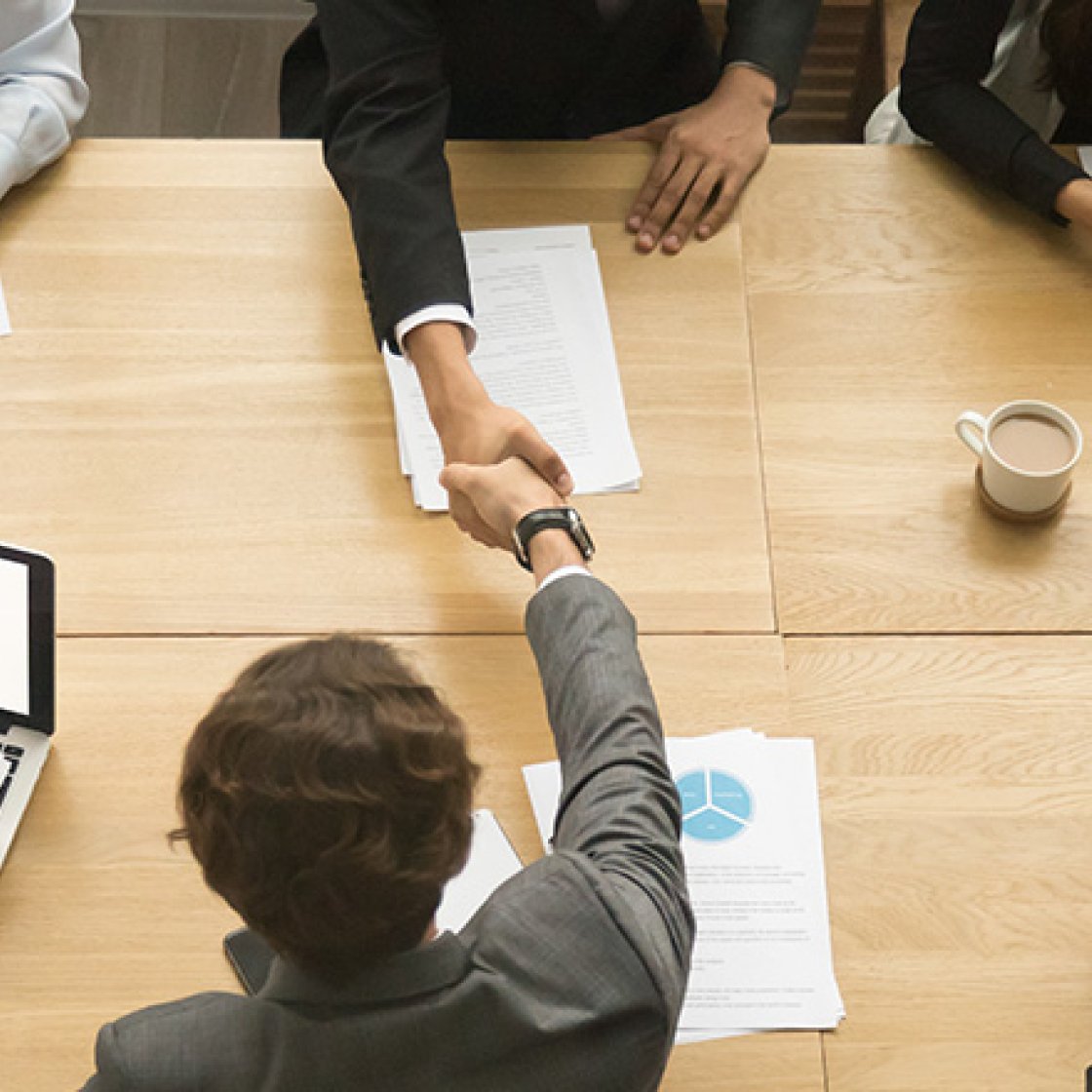 people sitting at a conference table