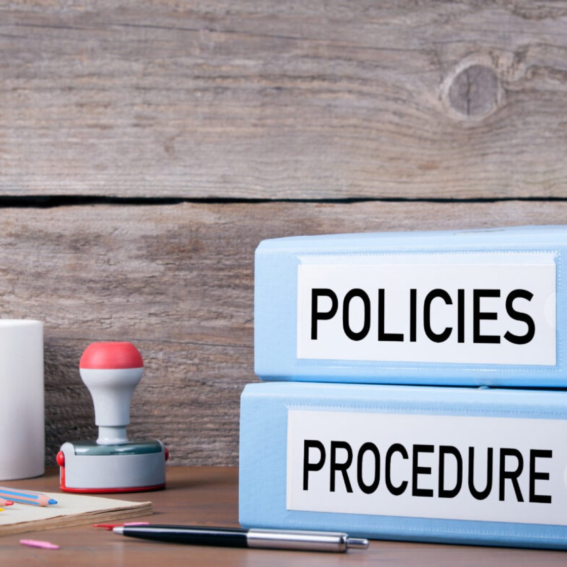 policies and procedures stacked binders