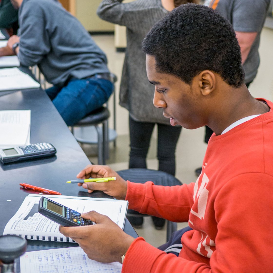 student solving a math equation