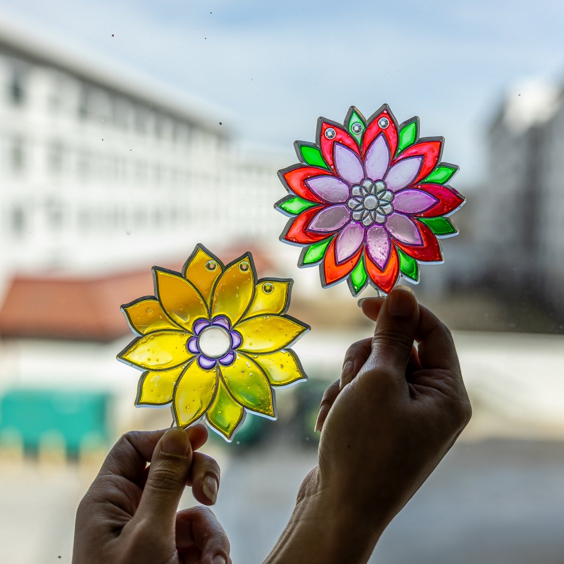 staged photo of painted sun catchers, a weekly rec night craft