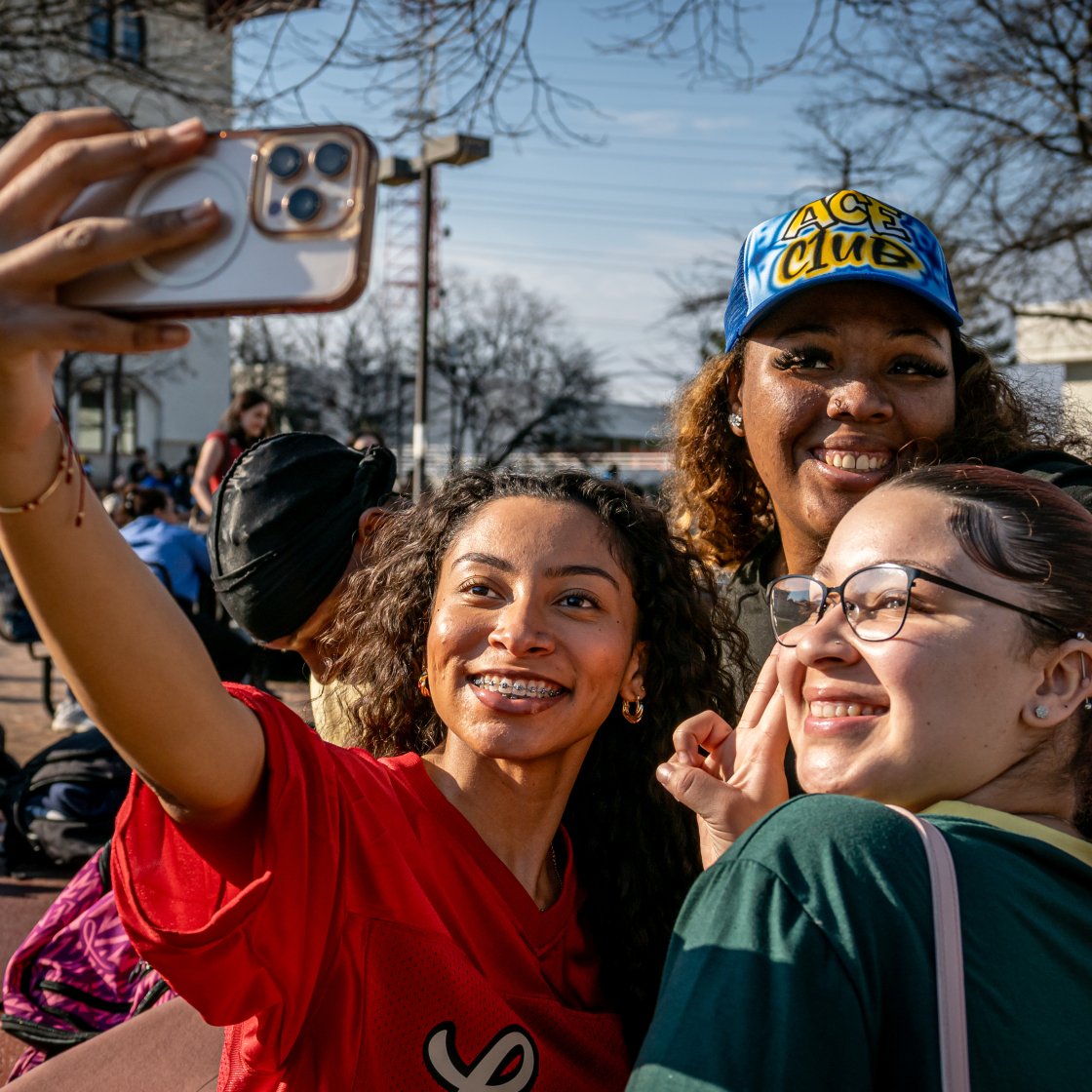 students taking a selfie on the quad
