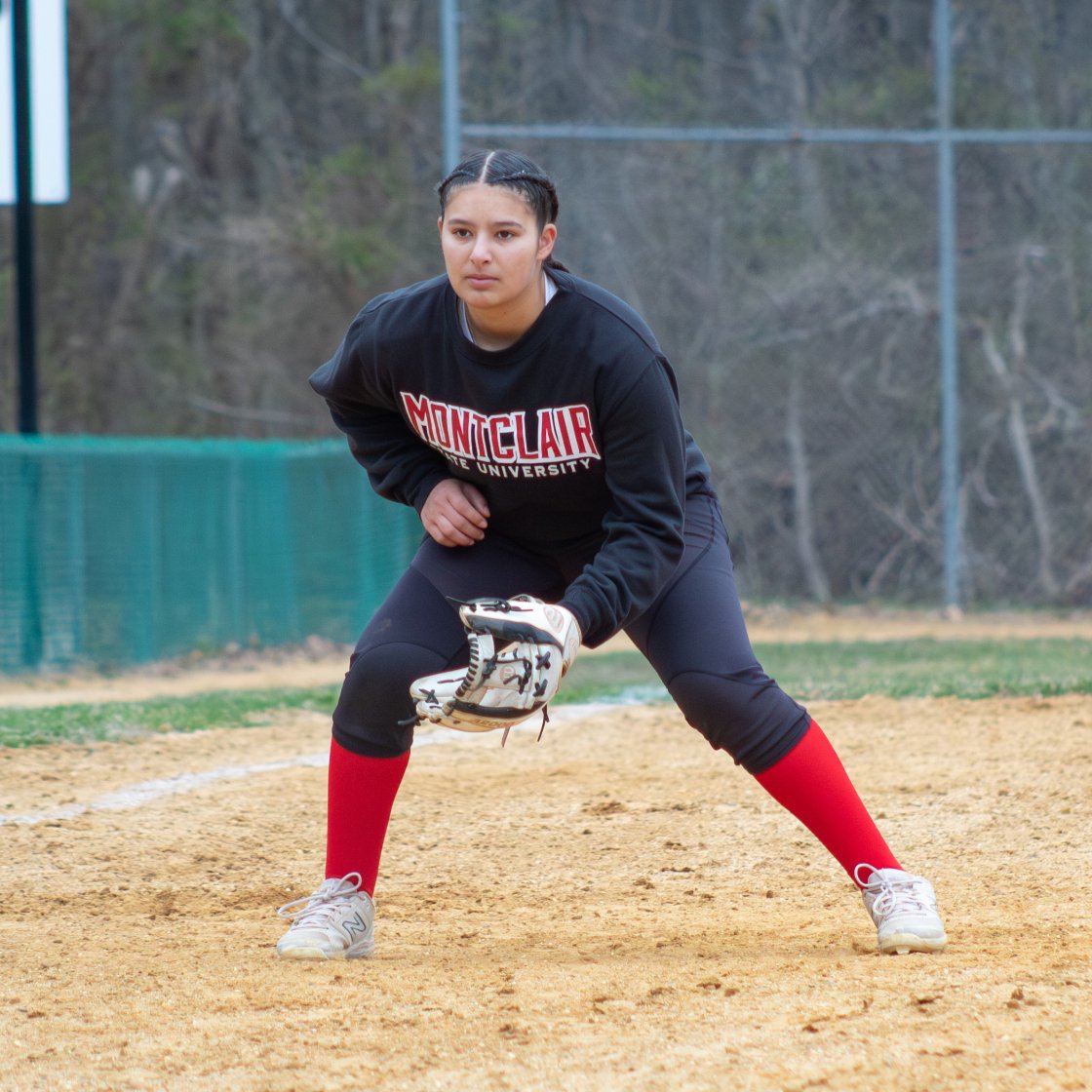 student playing club softball