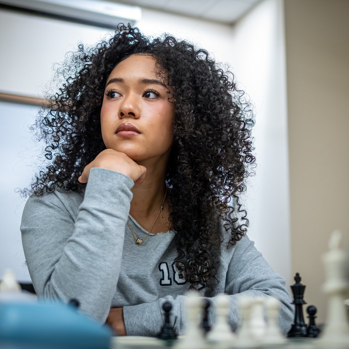 student playing chess at chess club