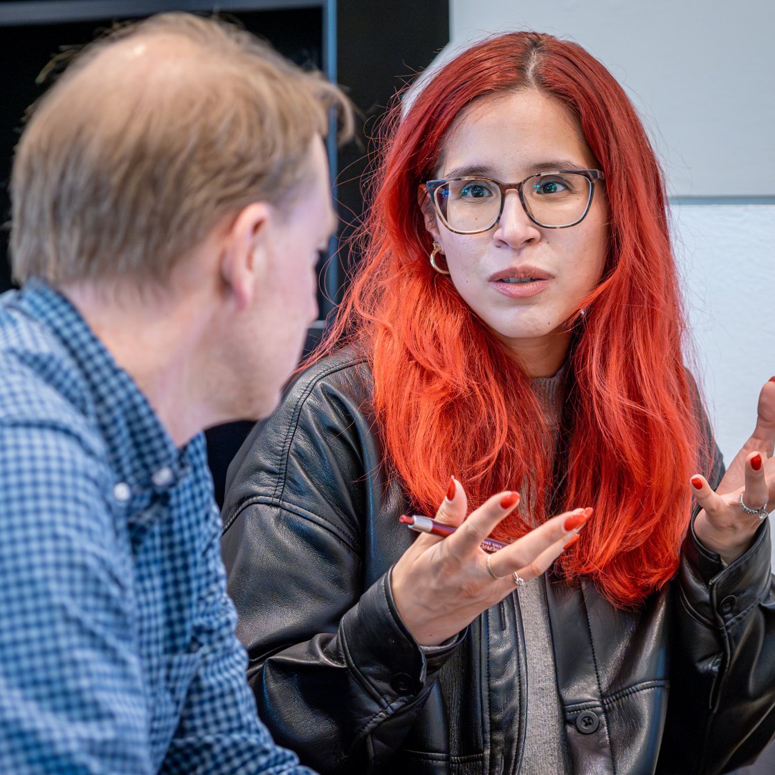student and employee having a discussion