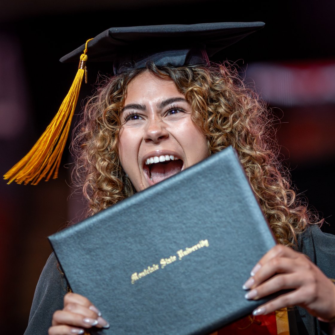 student with diploma