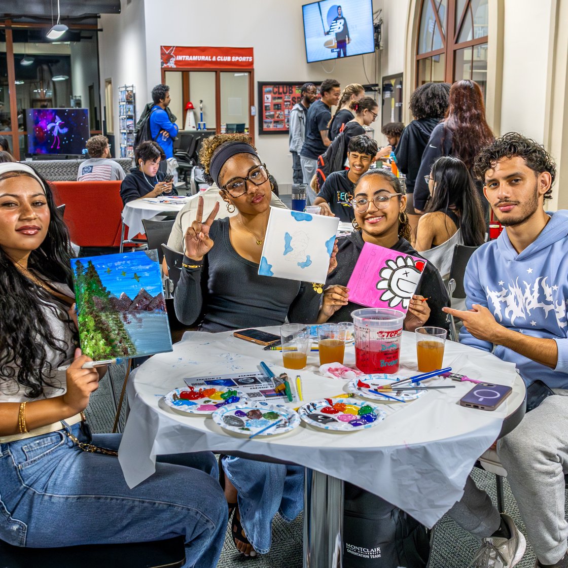 students with painting at a rec event