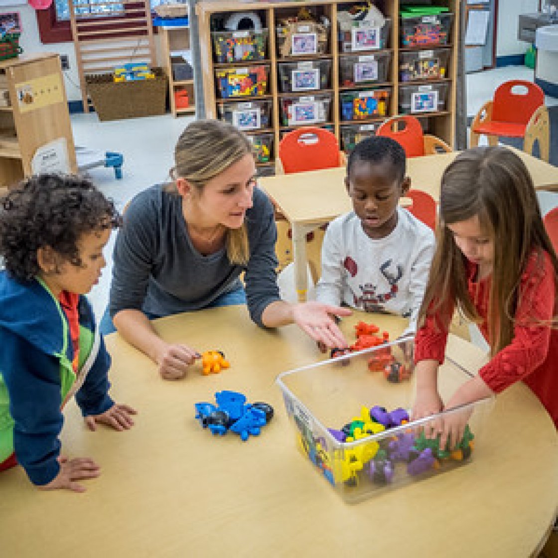 children playing with teacher