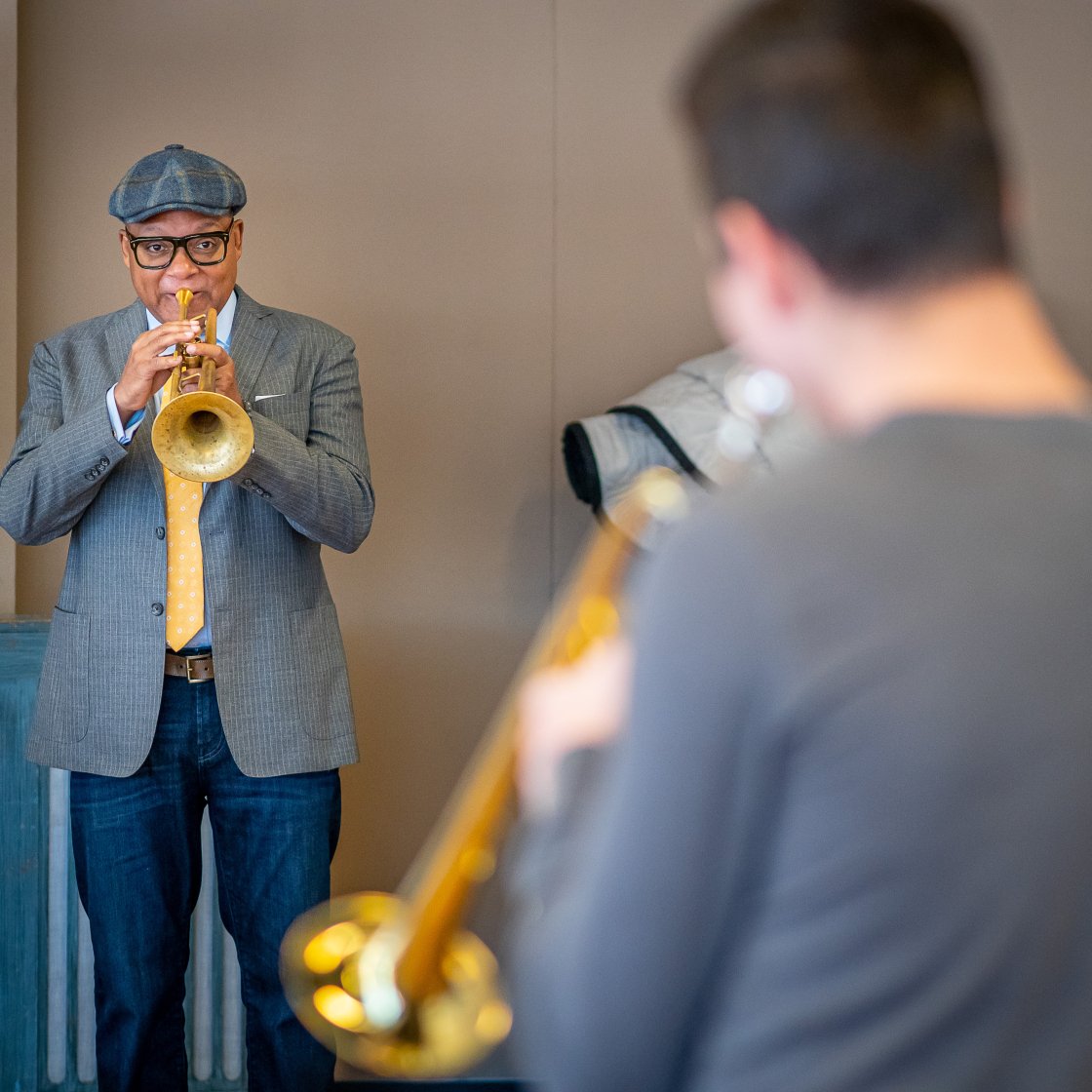 Wynton Marsalis plays trumpet with student in masterclass