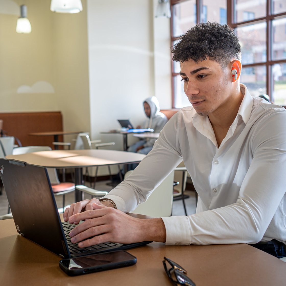 Student works from his laptop