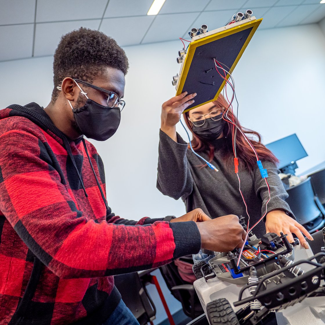 students working on a project for robotics club