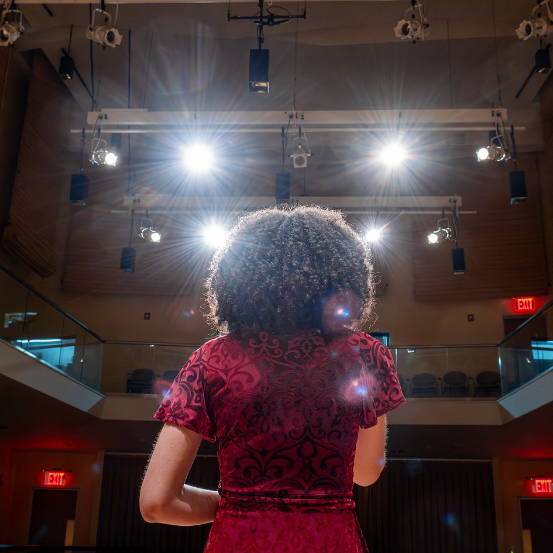 Back of a student's head on stage at Kasser Theater