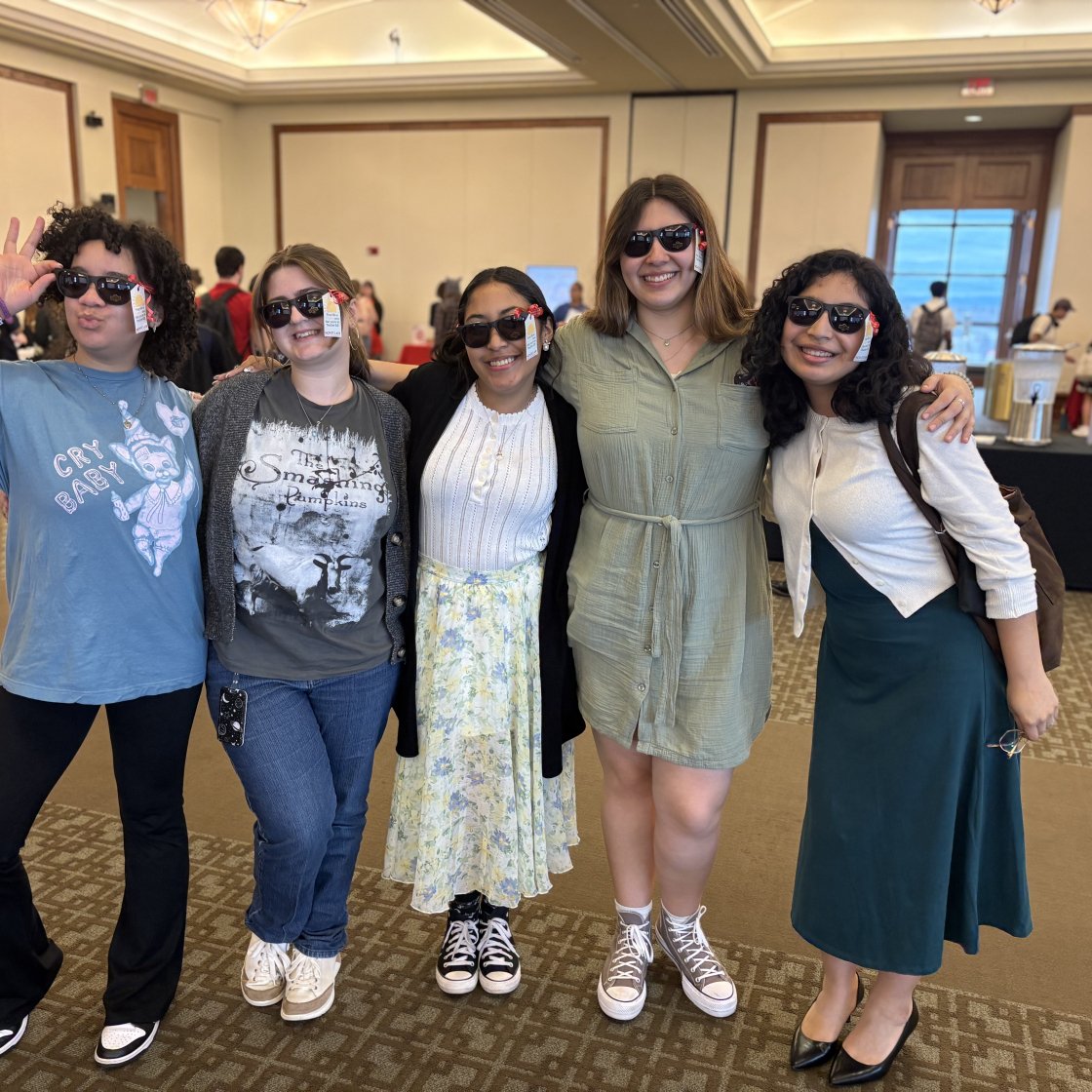 Teacher Ed students pose with branded sunglasses at orientation