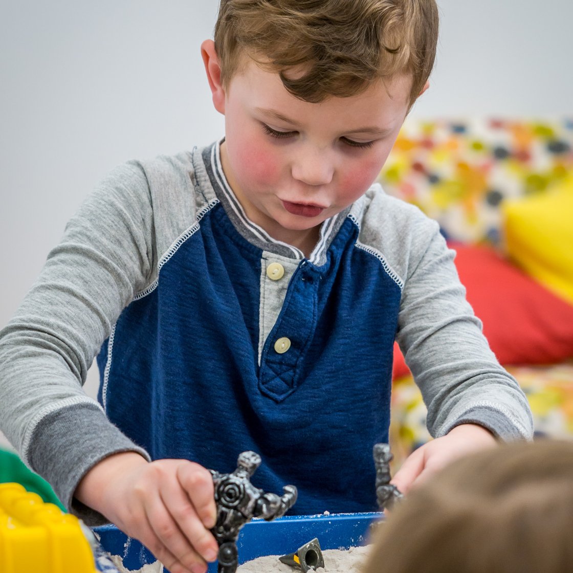 Child playing in sandbox