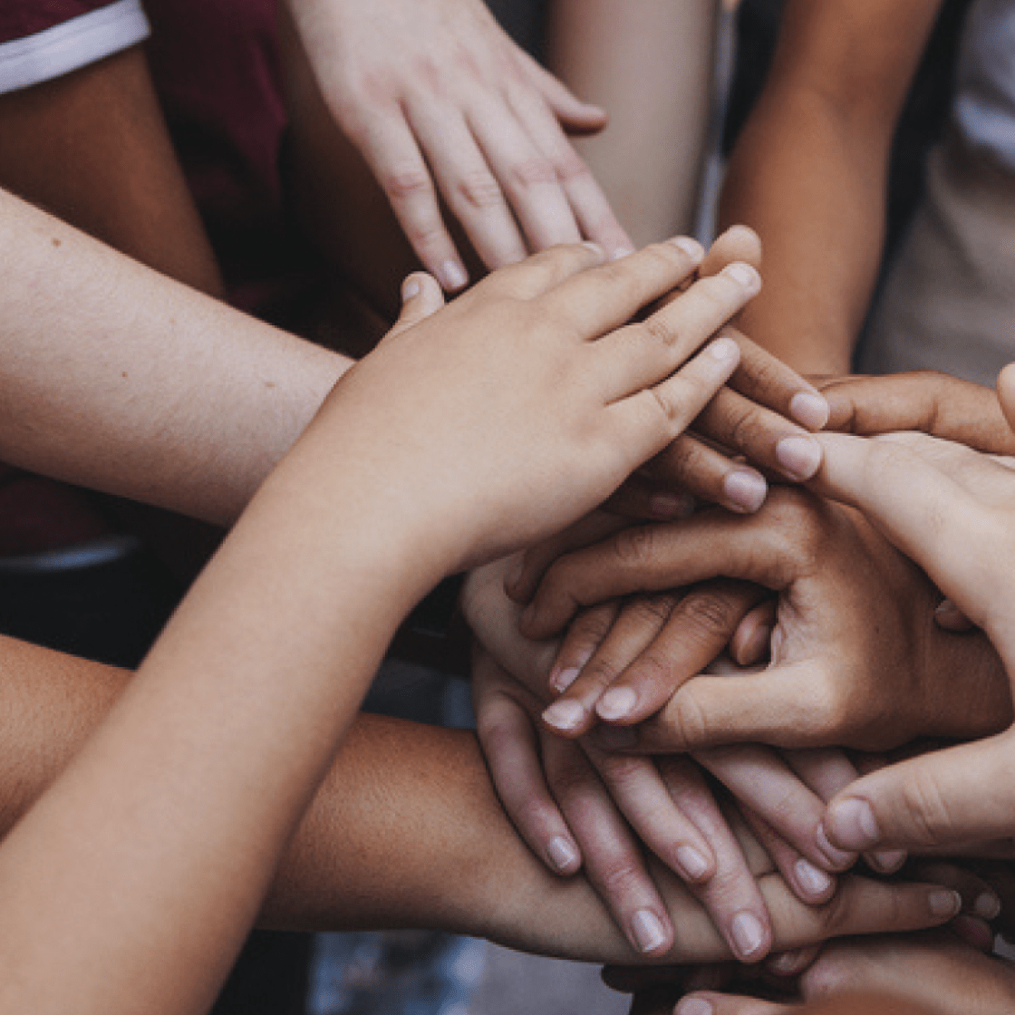 many diverse hands coming together