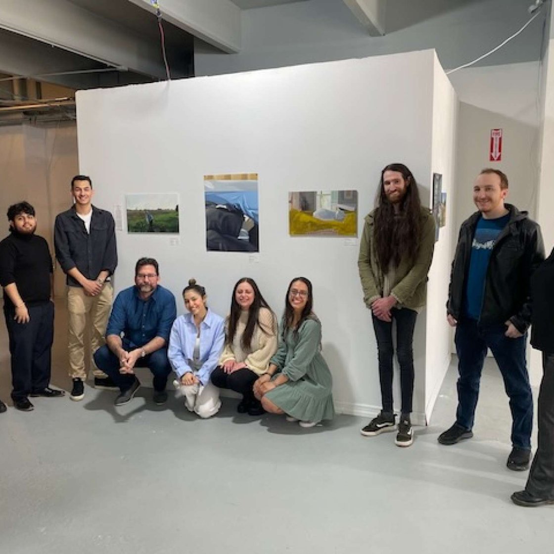 COIL Kaczmarek Spring 2023 Students in front of Art Wall