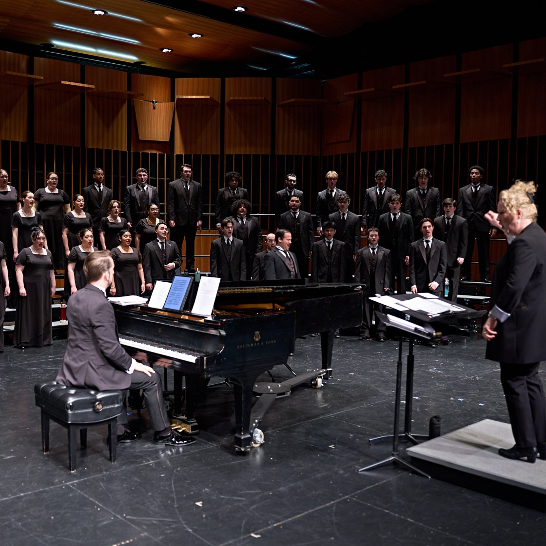 Chorale on stage with Dr. Buchanan and Accompanist