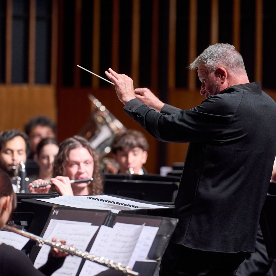 University Wind Symphony on stage performing