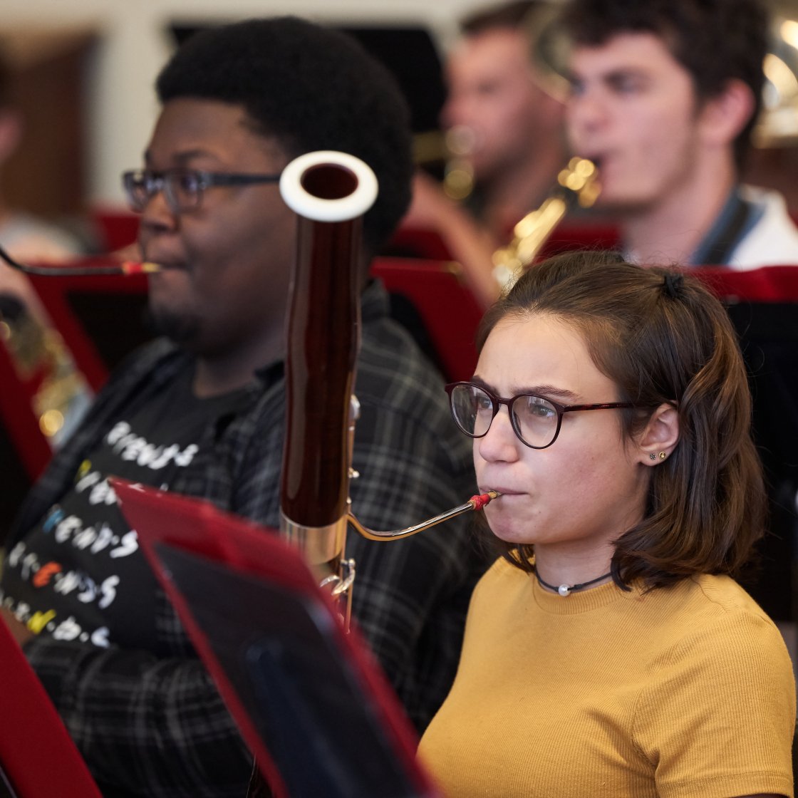 Two bassoon performers rehearsing