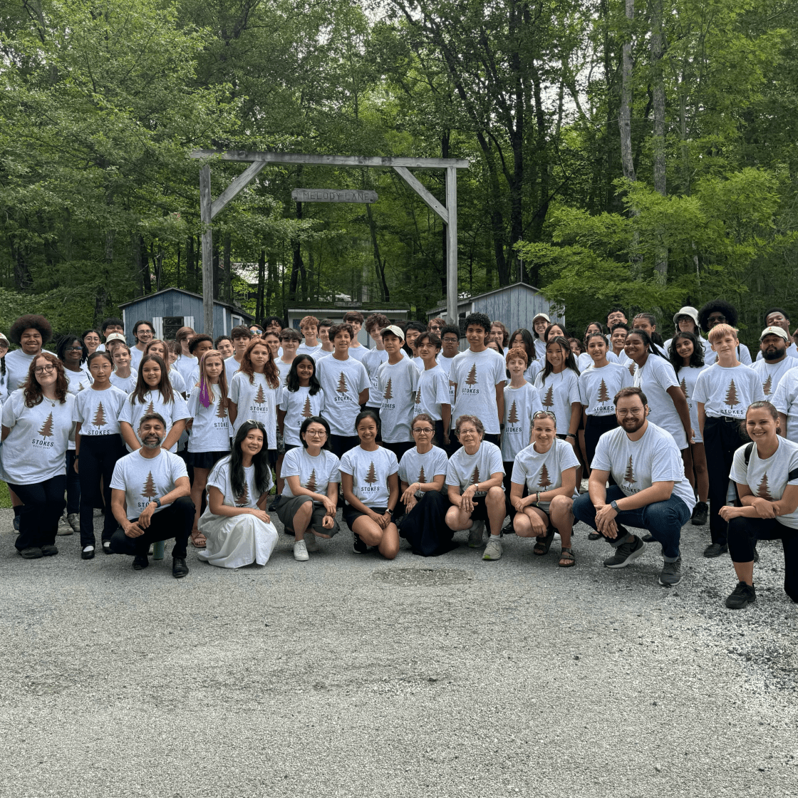 Stokes Campers in white camp shirts in group photo
