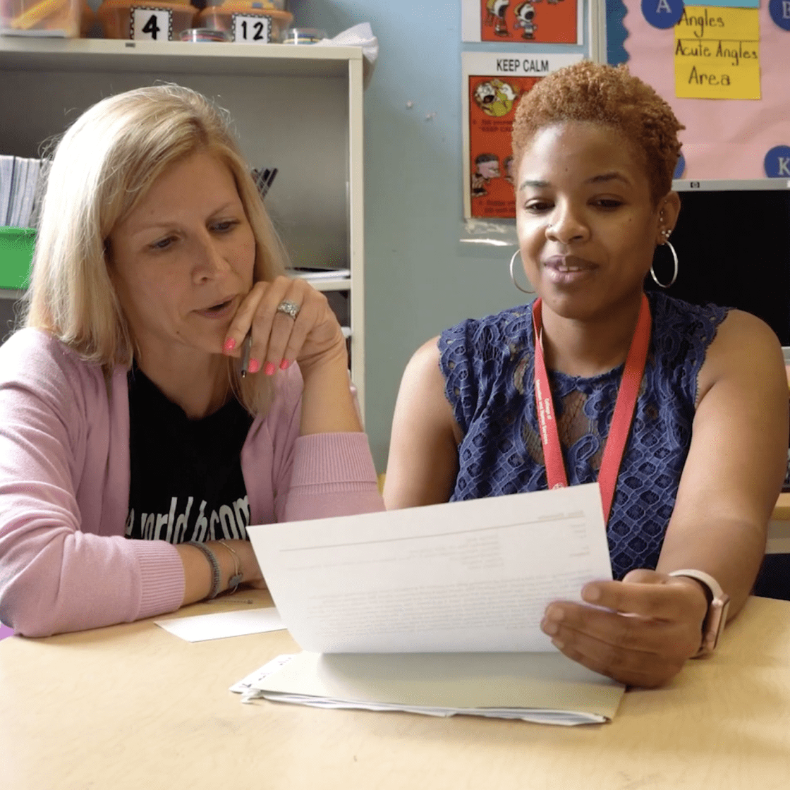 a first year teacher sits with her mentor
