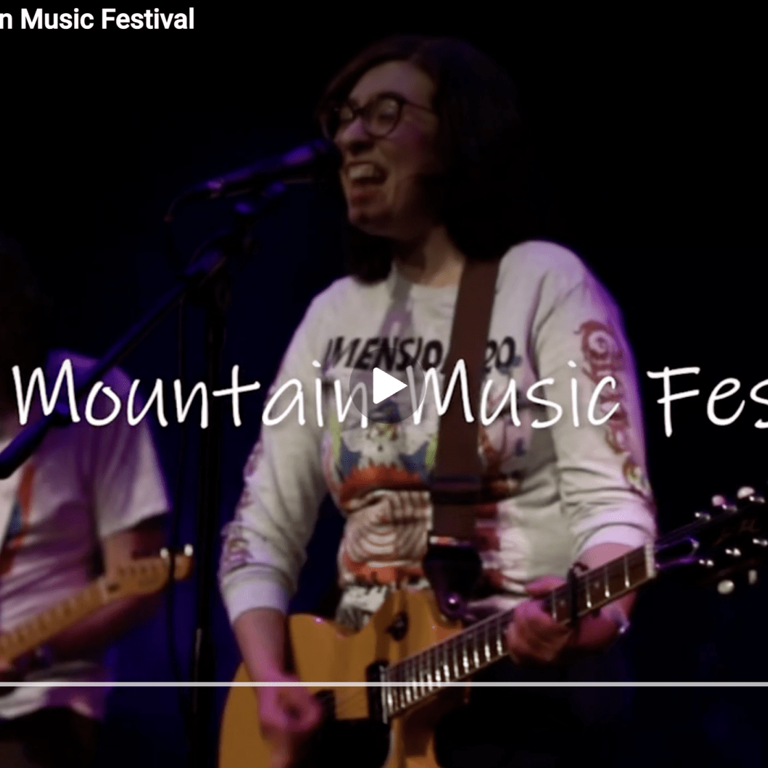 Screenshot of YouTube video thumbnail of the First Mountain Musical Festival coverage.