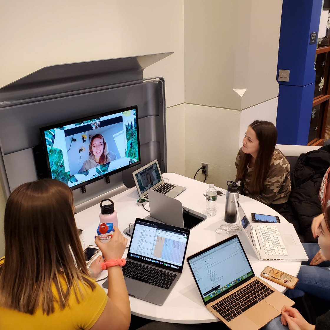 a group of students works at the ADP center