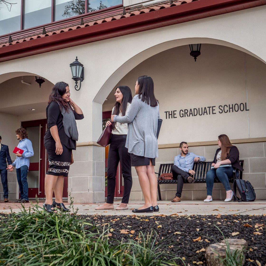 Students talking in front of the Graduate School