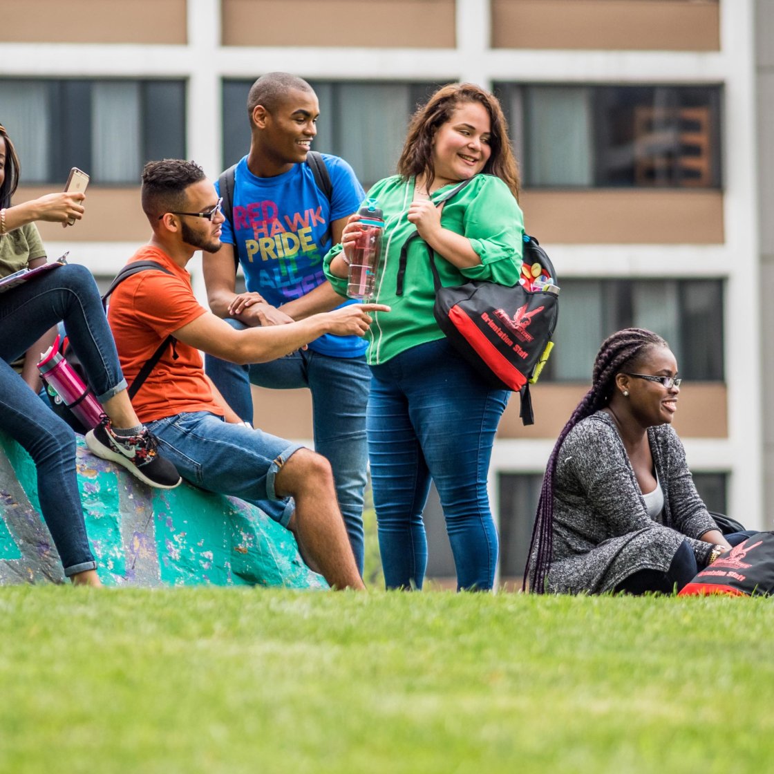 Students wearing colorful shirts in front of Bohn hall