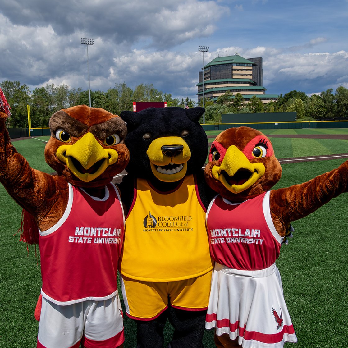 Rocky and roxy the Red Hawk mascots and Deacon the Bloomfield Bear mascot 