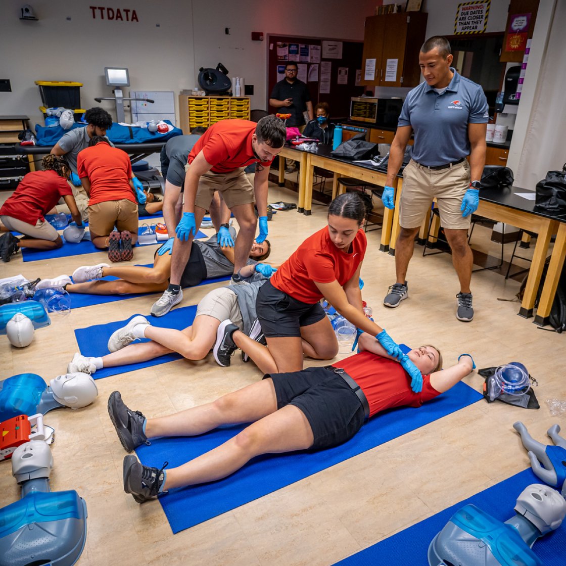 Athletic Training Students receive hands-on training from Kinesiology faculty.
