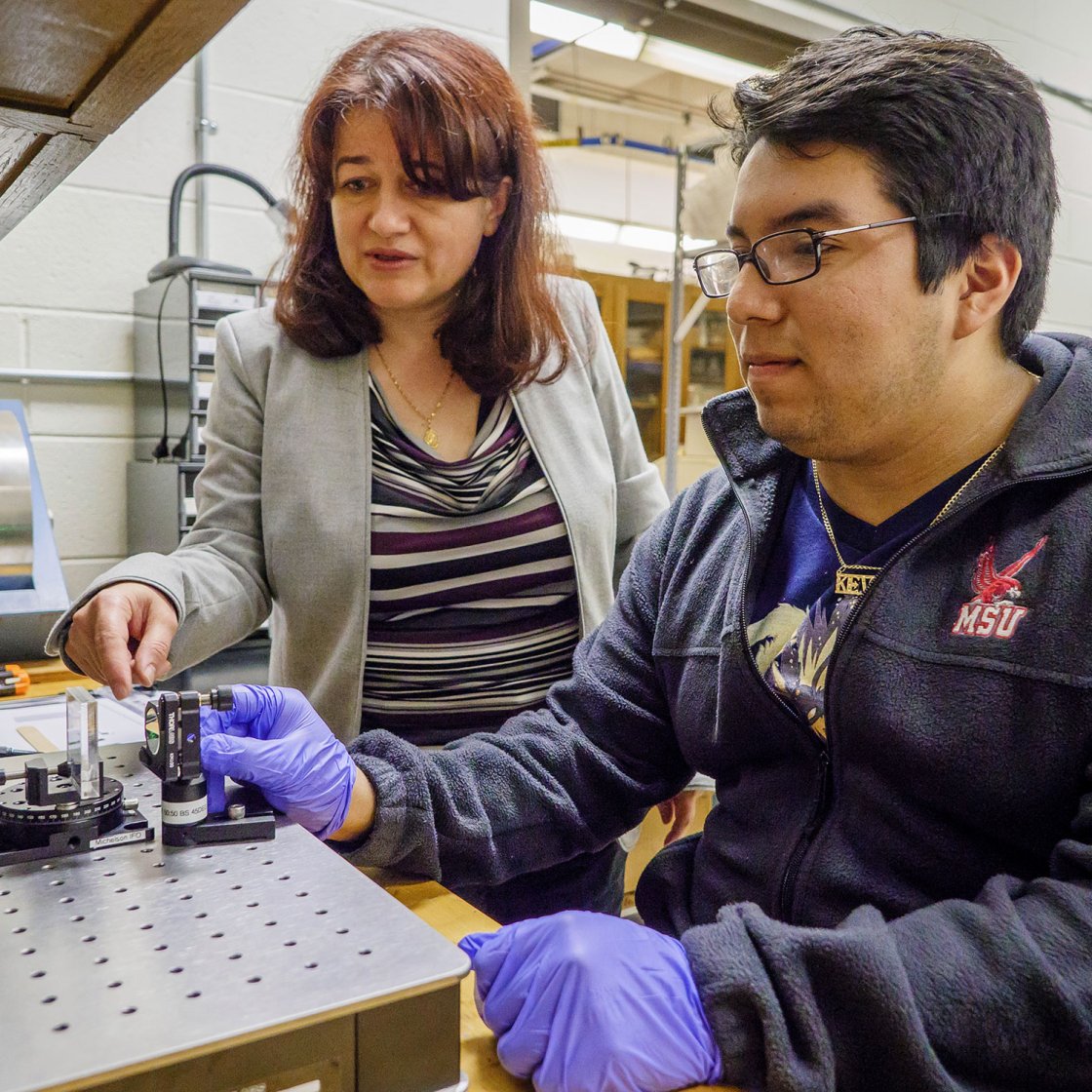 professor working with student on research