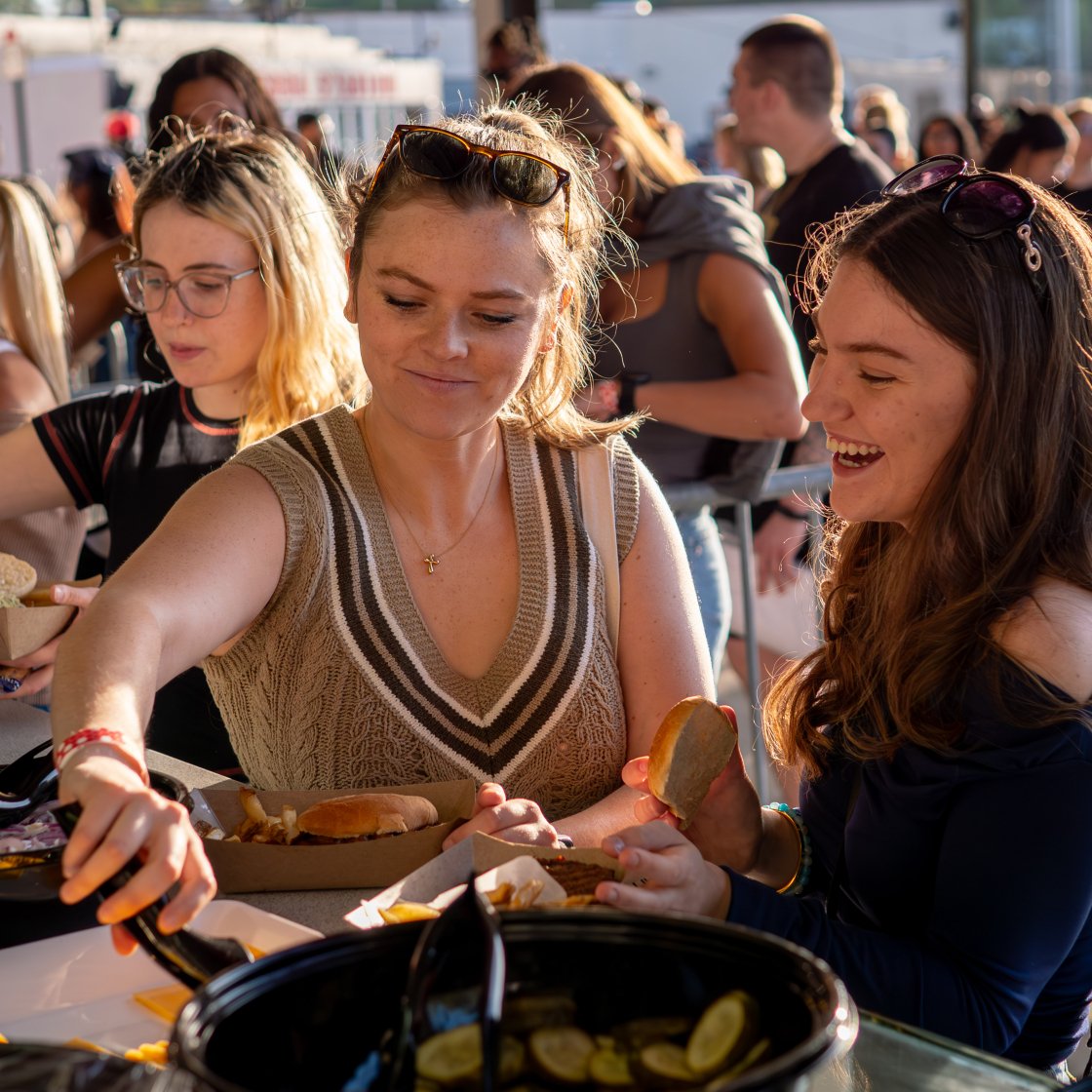 students serving themselves food at event