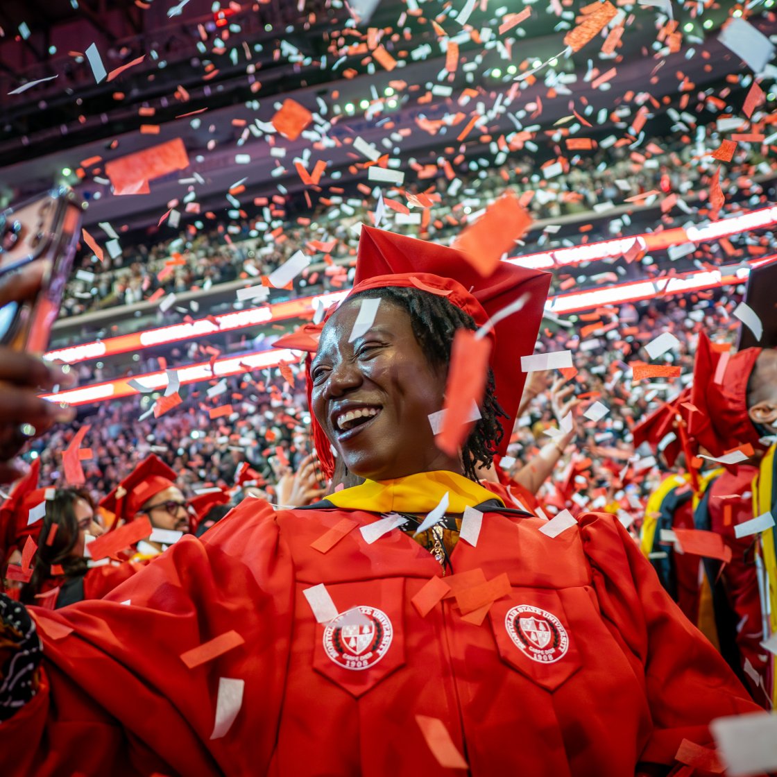 Master's graduate celebrates with confetti