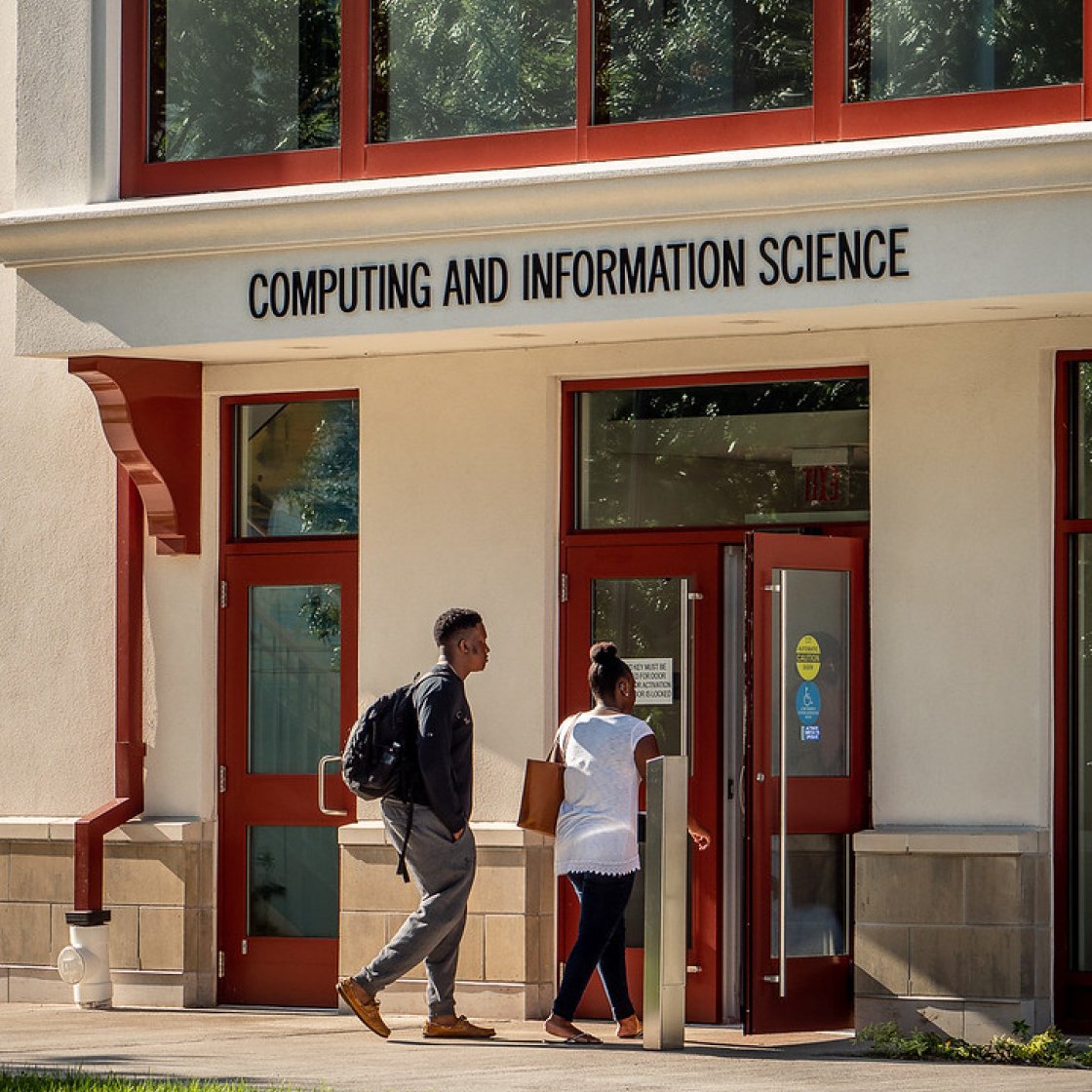 two students walking into the computing and information sciences building