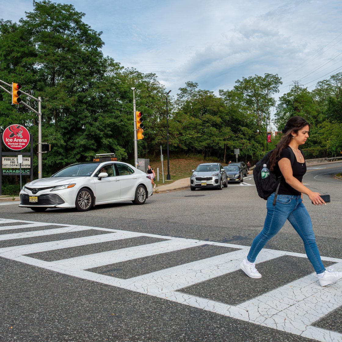 student walking on a cross walk