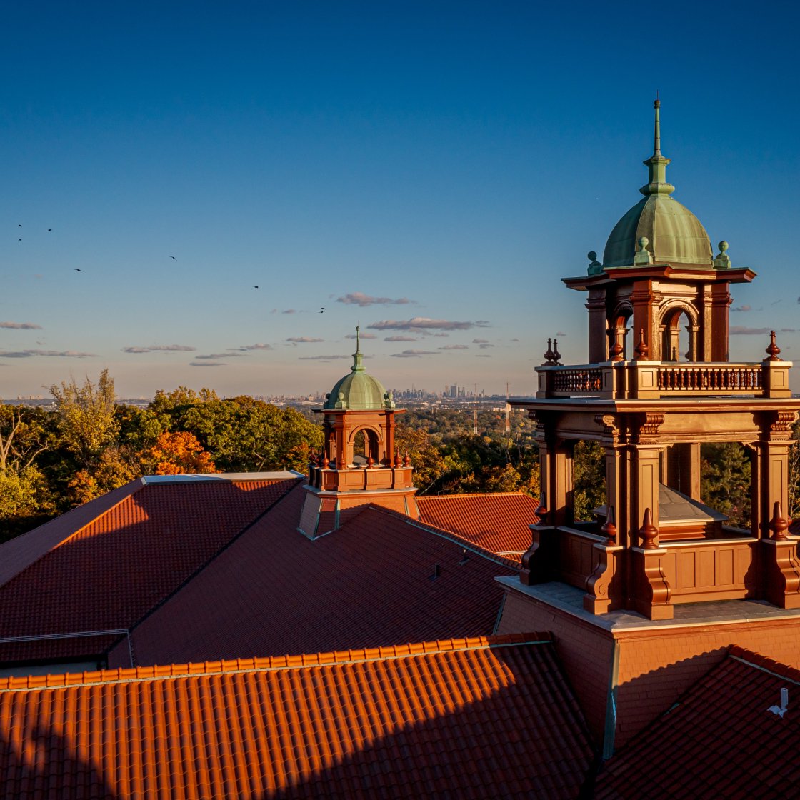 Aerial shot of Cole Hall with the sun setting.
