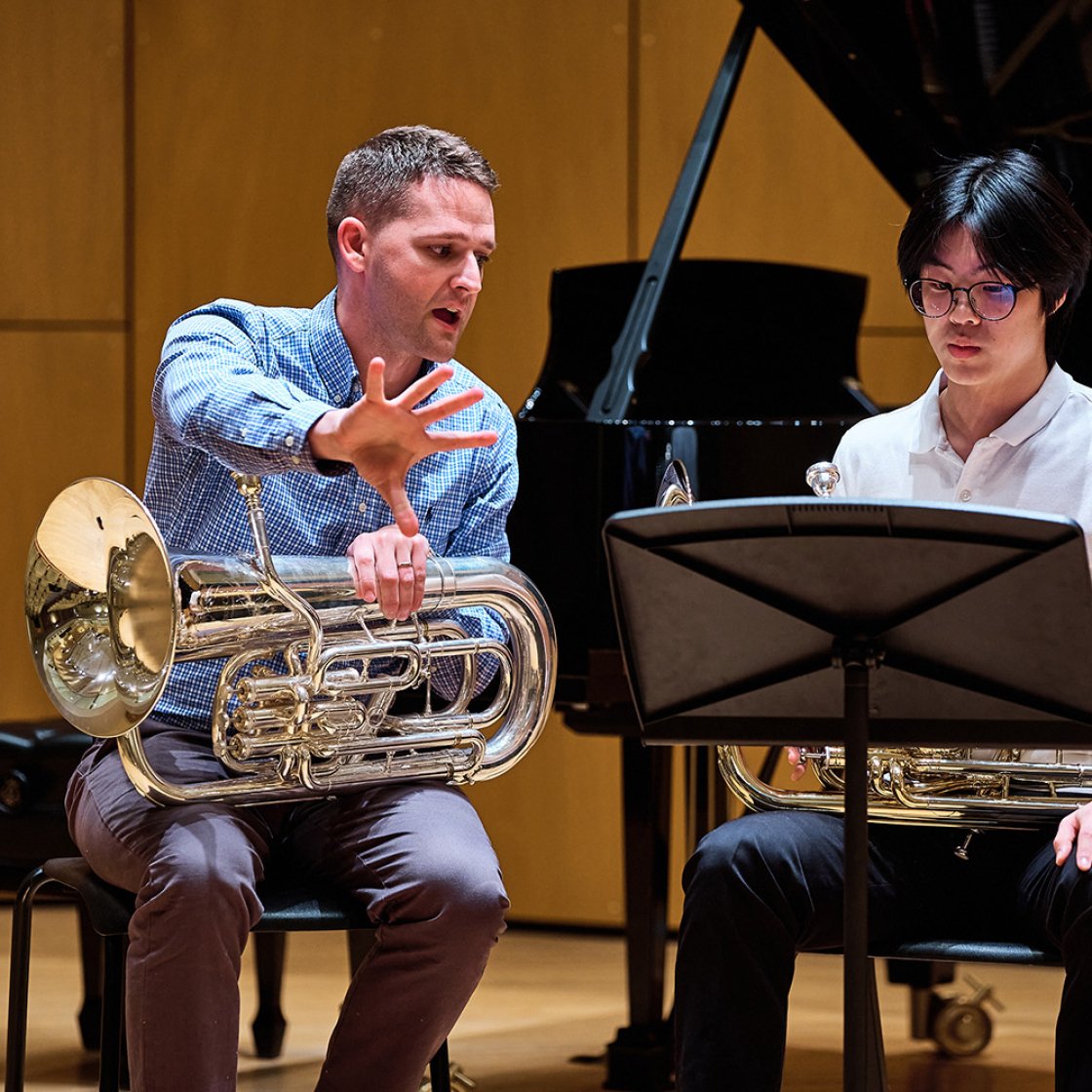 Cali Pathways euphonium student in lesson with professor on stage