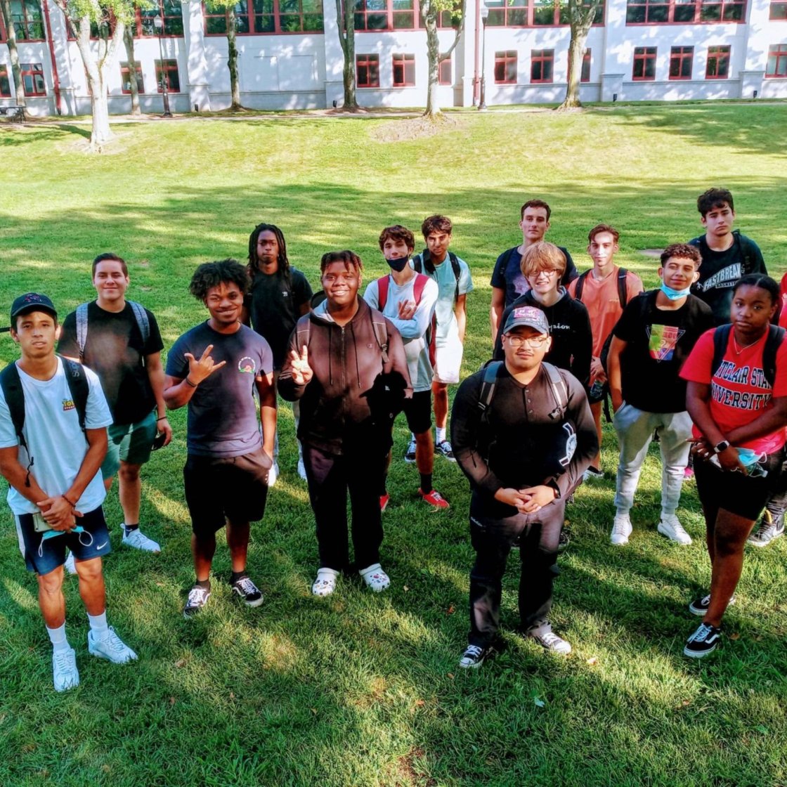 A group of college students pose outside